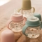 Suavinex My Family - Biberon First con manico e beccuccio in silicone - Pistacchio